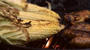 Detail picture of corn and chicken browning on the grill