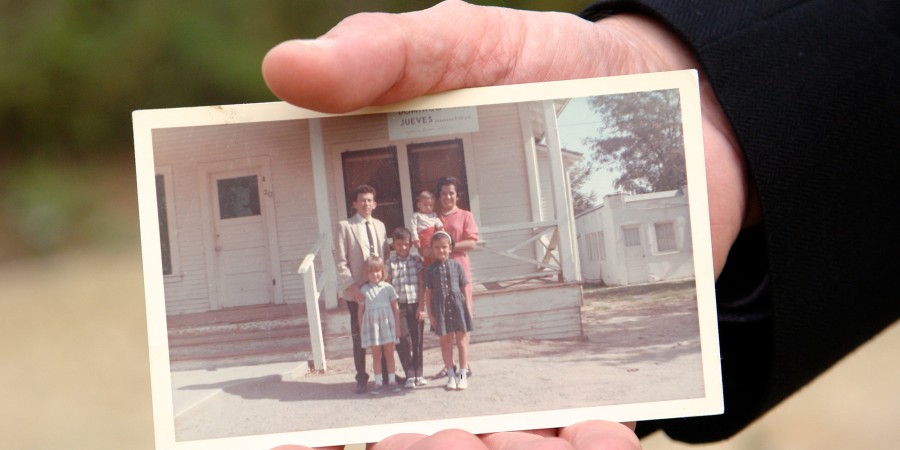 Fuller Seminary Vice Provost holding a photo of his family